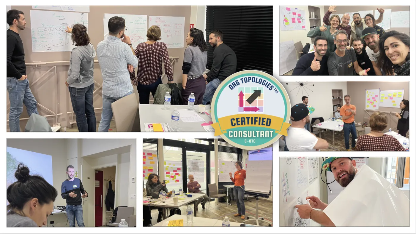 Bootcamp participants working at the Org Design Studio wall, the Obeya